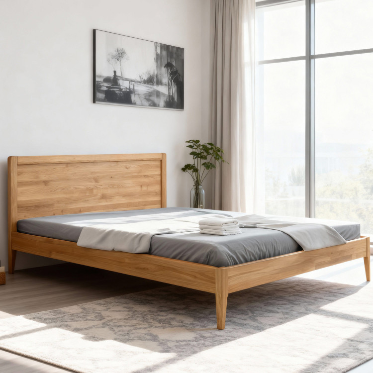 Manželská postel na nohou z dubu model Praha