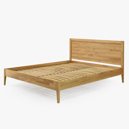 Manželská postel na nohou z dubu model Praha