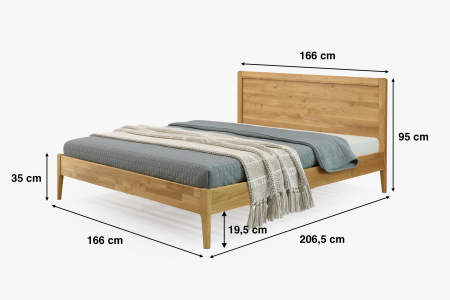 Manželská postel na nohou z dubu model Praha