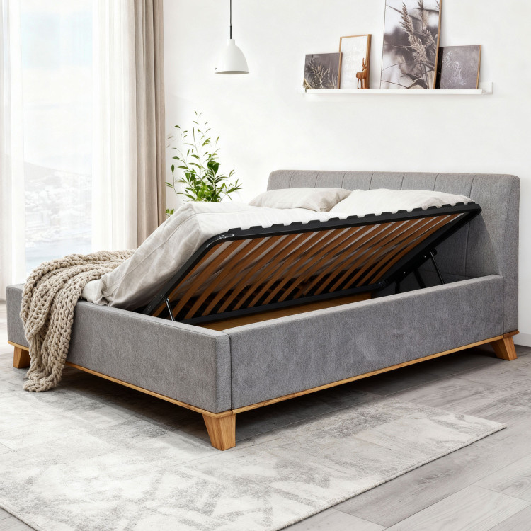 Manchettbett auf Füßen mit Stauraum 180 x 200 cm