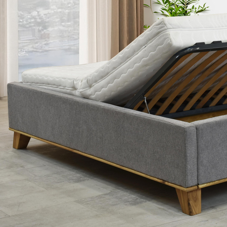 Manchettbett auf Füßen mit Stauraum 180 x 200 cm